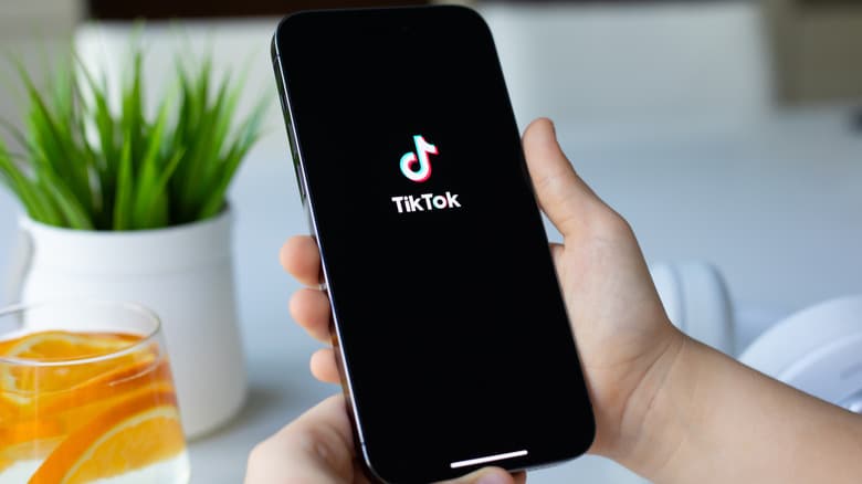 TikTok app loading on an iPhone 15 Pro