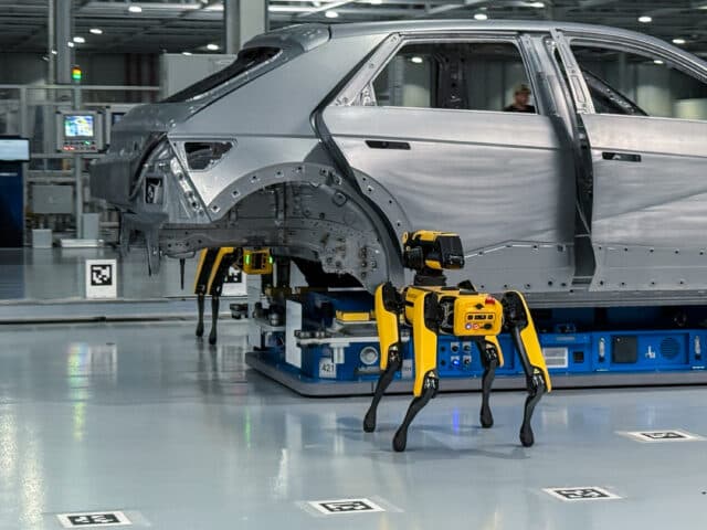A pair of Boston Dynamics robots inspect a Hyundai Ioniq 5 body shell at the HMG Metaplant outside Savannah, Georgia.