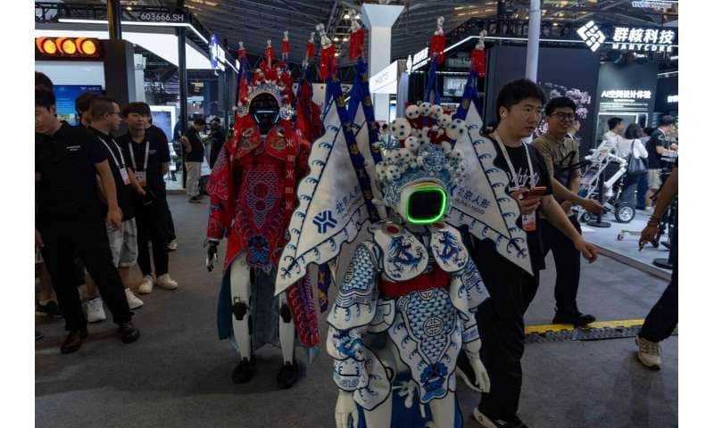 Robots wearing traditional Chinese opera costumes walk around the booths at the World AI Conference in Shanghai, Friday, July 17, 2026. Credit: AP Photo/Ng Han Guan