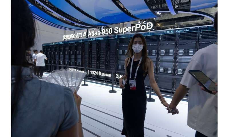 Visitors stand near the Huawei Atlas 950 SuperPod during the World AI Conference in Shanghai, Friday, July 17, 2026. Credit: AP Photo/Ng Han Guan