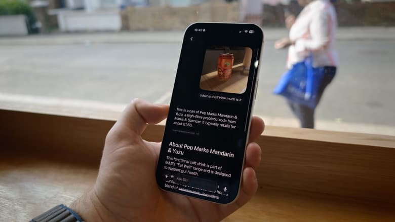 An iPhone showing Siri AI on iOS 27 identifying a soft drink.