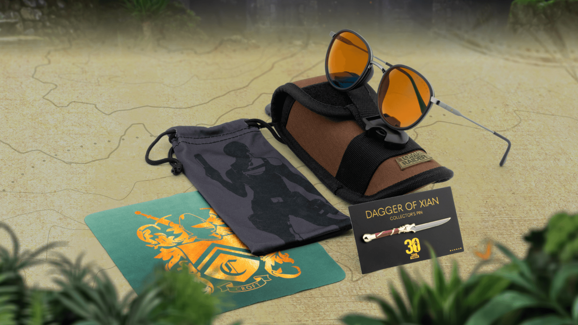 The GUNNAR Tomb Raider Croft glasses in Amber Max with accessories.
