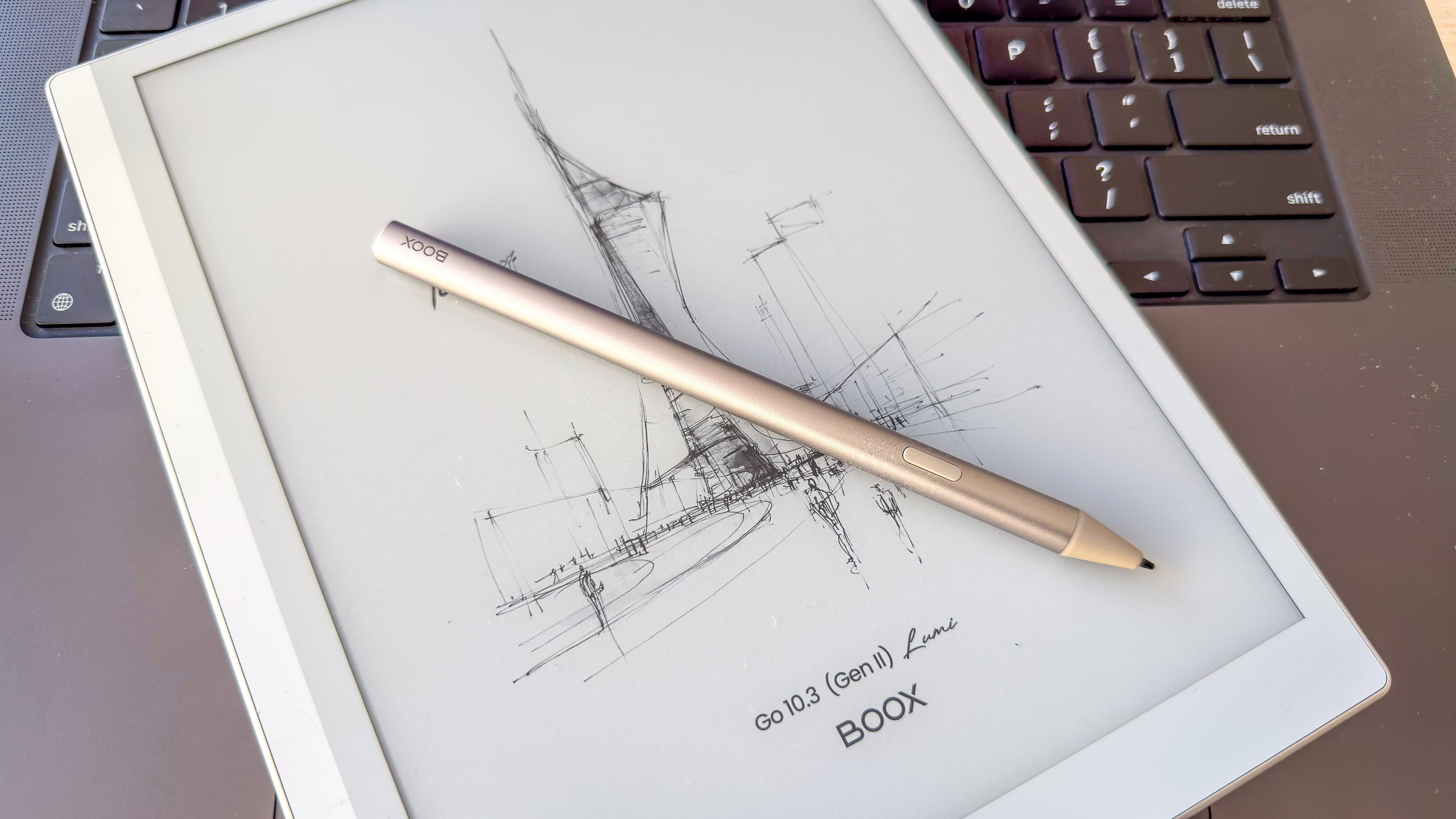 Boox Go 10.3 Gen II Lumi and its InkSense Plus stylus lying on a laptop