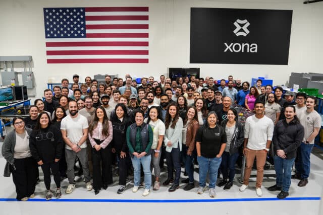 A group photo of the Xona Space Systems team inside the company's factory in Burlingame, California.